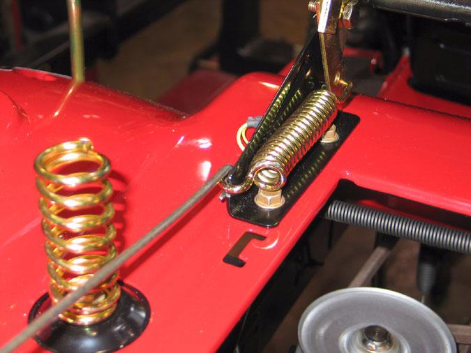 6.3. Using a spring puller, carefully remove the seat spring. See Figure 19. 6.5.