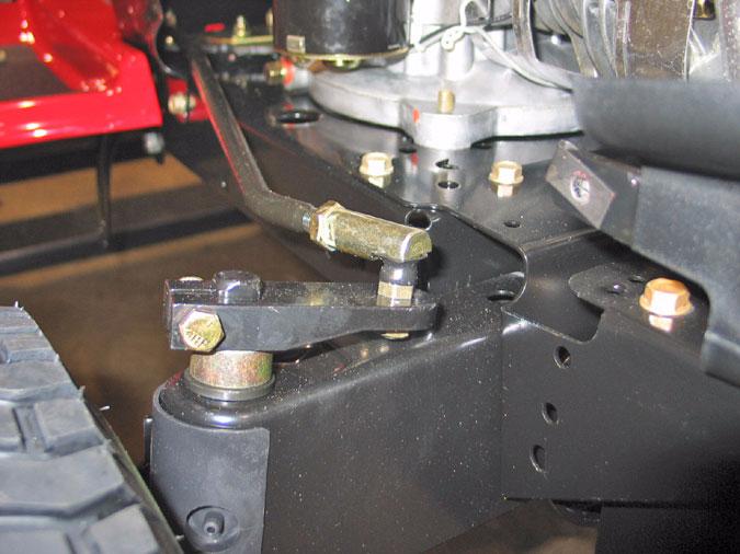 15.9. Using a ½ wrench on the top and a 9/16 wrench on the bottom, remove the nut securing the drag link to the steering arm. See Figure 60. 16.3.