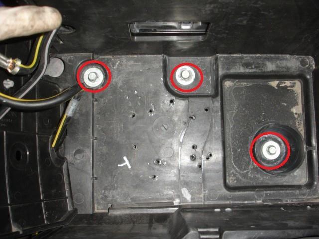 Remove the battery and ECU covers by using a 10mm socket to remove the battery
