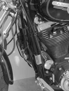 frame downtube. The following procedure covers how to relocate the clutch cable. If the oil cooler is being installed on a 19