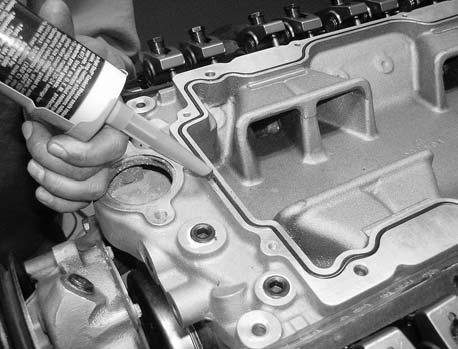 Carefully install the intake manifold onto the engine, making sure the ports and bolt holes line up with the gasket. For 1986 and earlier applications, you may install the intake manifold bolts.