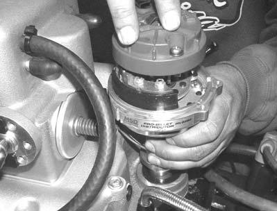 6. For 1986 and earlier applications, install the top plate to intake manifold bolts and torque bolts to 8-10 ft./lbs.