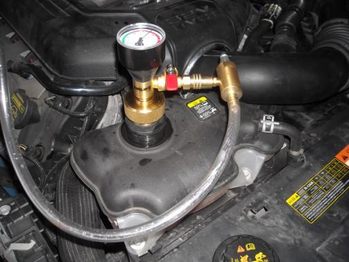 STEP 19: STEP 20: STEP 21: STEP 22a: Fill the radiator through the degas bottle until the coolant level is between the COOLANT FILL LEVEL marks.
