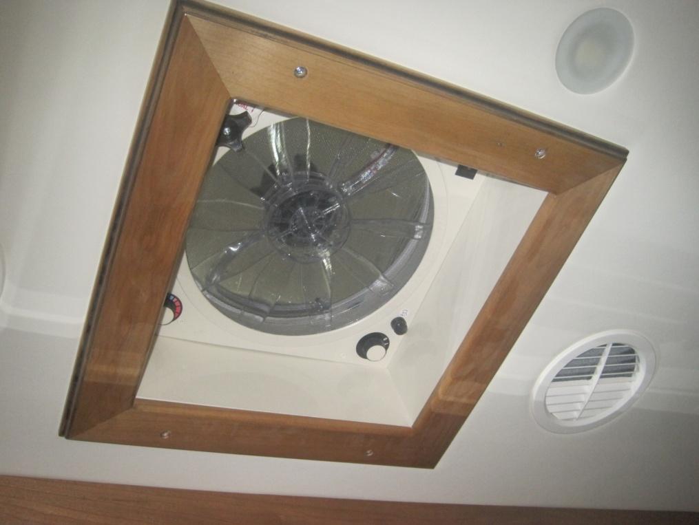 Improved ceiling appearance with wooden mold and trim ring on