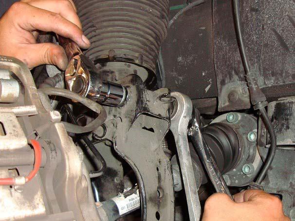 7. REMOVE THE SWAY BAR END LINK TO SHOCK MOUNTING BOLT.