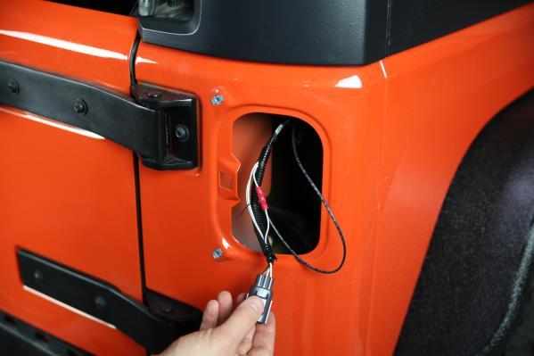 Pull the wire out until you have room to strip the wire to crimp into the tail light harness.