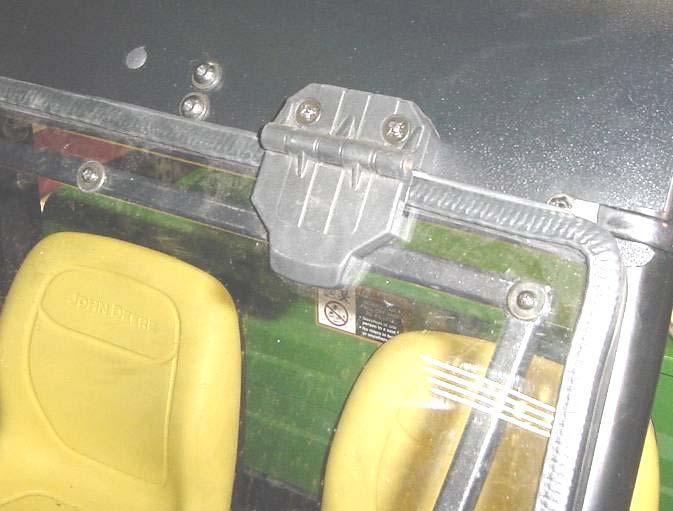 2 Per fig. 2.2, orient the P-clamp so the flat straight portion is outboard as shown (on top of the windshield support, not underneath it). The curved portion of the P- clamp is to be inside the cab.