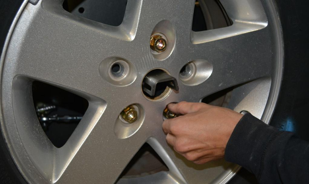 Use a shop press or hammer to drive the three provided Wheel Studs into the mounting plate, using the holes that were marked in the previous step.