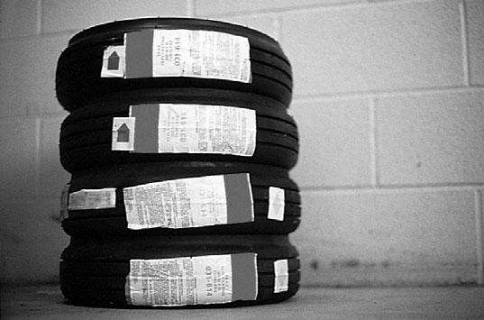 STORES TIRES VERTICALLY Whenever possible, tires should be stored in regular tire racks which hold them up vertically.