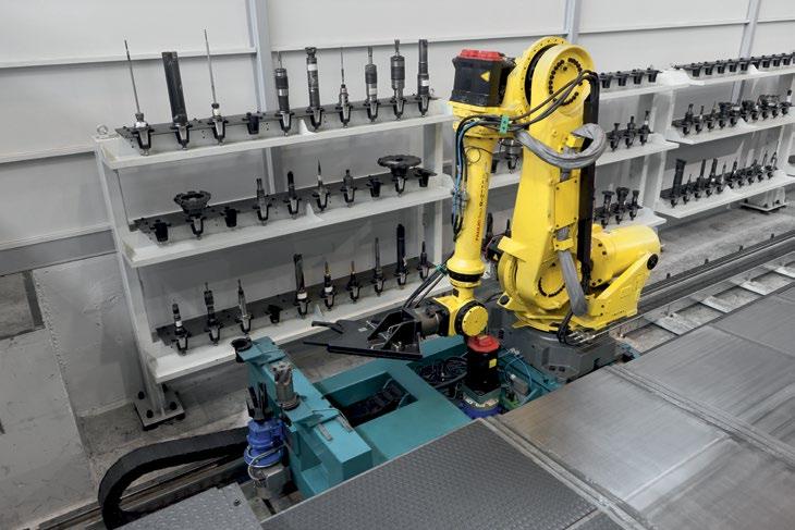 robot mounted on slide with concurrent movement on X axis serving the floor mounted rack type tool magazine TOOL MAGAZINES VERTIRAM may be customized to meet specific requirements