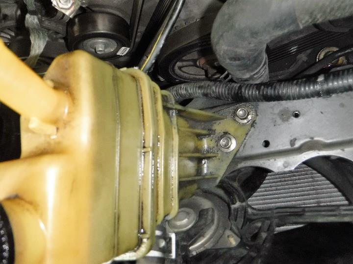 Remove the two M6 bolts from the P/S reservoir mounted