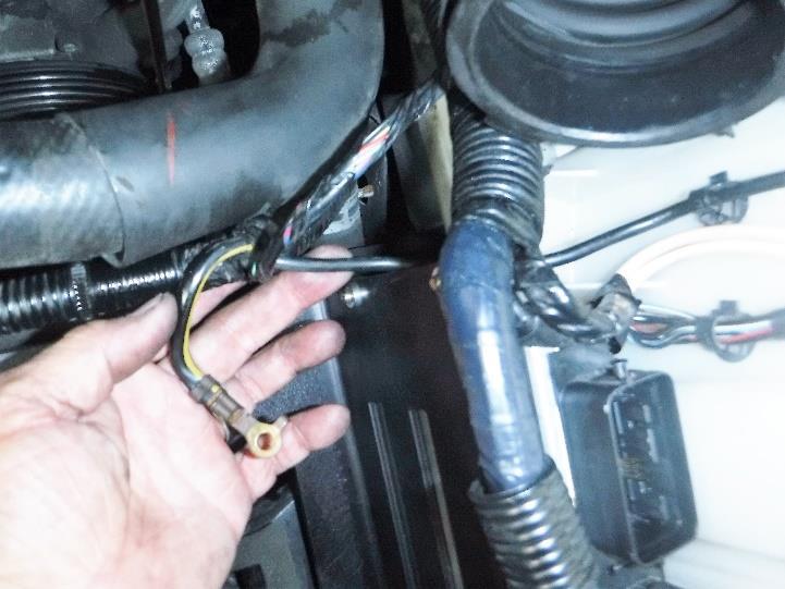 Install the ground strap as shown in Photo 2-10 using an M6x12 bolt. Reinstall the harness connectors back into the ECU as shown in Photo 2-11. Each harness has a designated connection.
