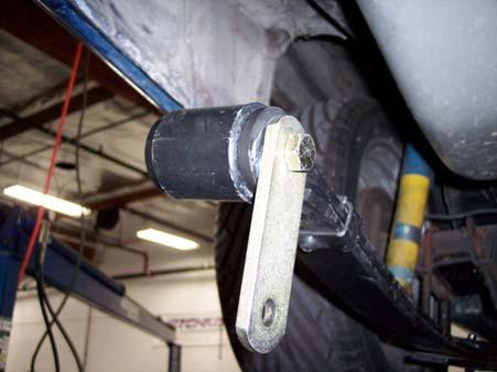 When assembling rear shackle bolt through frame bushing, make sure the head of the