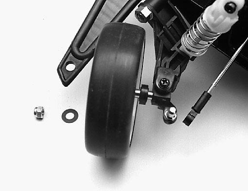 Mount the front wheels by first sliding the spacer on the axle, followed by a wheel, a 5x10mm fiber washer,