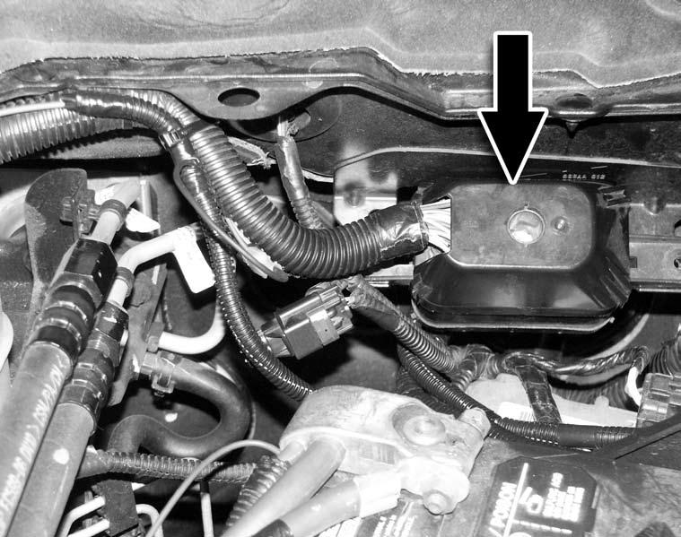 Locate the large black connector on the driver side between the battery and the firewall in the engine compartment. See Figure 7.