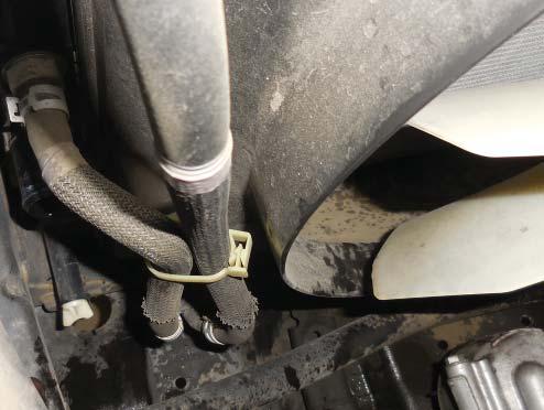 73. This step applies only to the FJ. Remove the hose clamp at the location shown with the arrow.