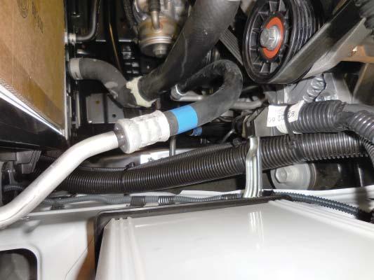 273. Secure the wire loom for the intercooler pump next to the hose shown using the provided cable ties in the