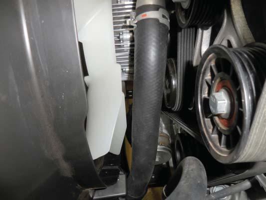 Reconnect the lower radiator hose ensuring that the upper part of the hose is rotated to allow about 1/4 clearance between the