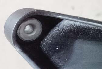 Remove the steel bushing and two (2) rubber grommets from the