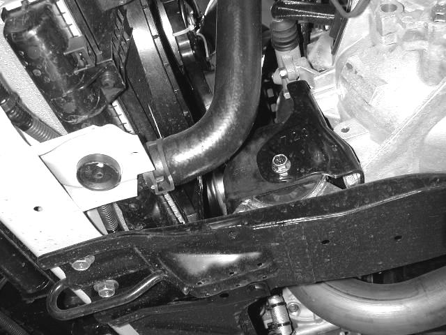 k) For best fitment, it may be necessary to loosen the spring clamp on the lower radiator hose and rotate the hose away from the lower intake pipe.