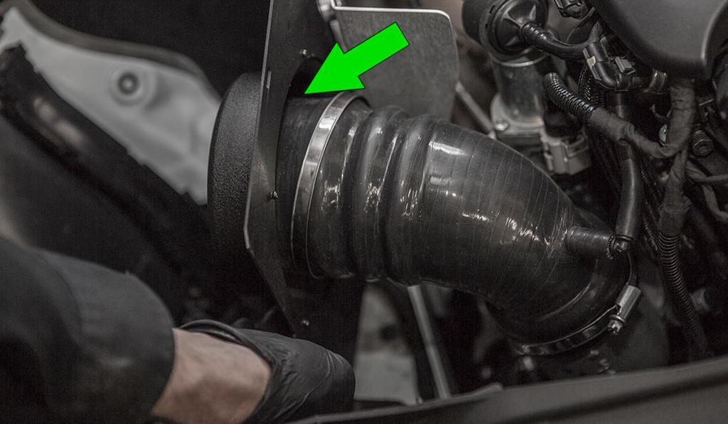 With the heat shield in place, (do not install the grommets to the vehicle in this step). Install the turbo inlet silicone to the velocity stack.