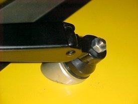 Replace the plastic cover over the nut as illustrated below. 6.