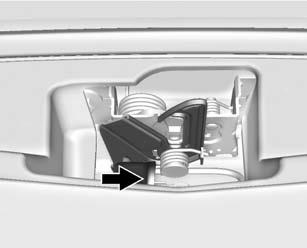 Vehicle Care 263 2. Go to the front of the vehicle to find the secondary hood release handle. The handle is under the front edge of the hood near the center.