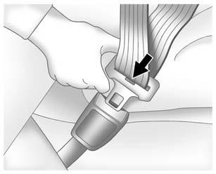 Push the latch plate into the buckle until it clicks. Pull up on the latch plate to make sure it is secure. If the belt is not long enough, see Safety Belt Extender 0 71.