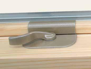 Color matched double hung tilt latches are set into the check rail of the bottom sash and concealed in the top rail on the upper sash.