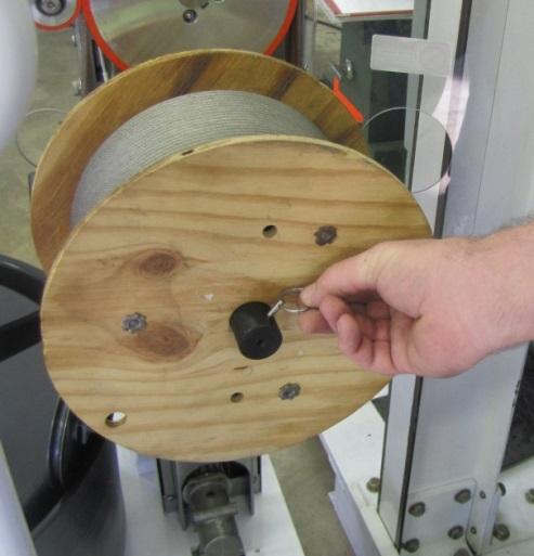Slide the shipping reel on the extension and attach the wire rope following the OEMs instructions.