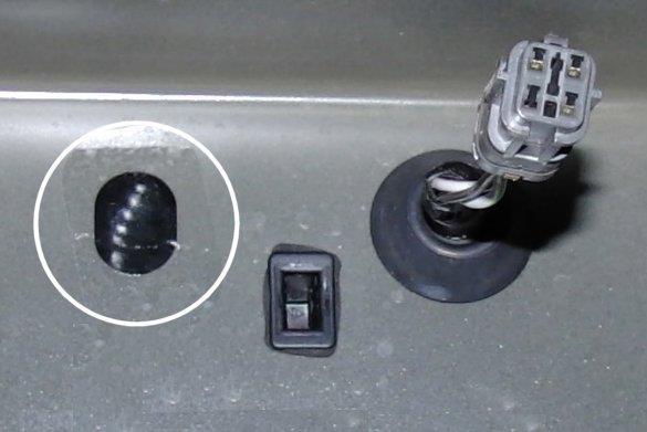 21) On the trunk lid, there is a hole to the left of the OEM harness connector. Remove the tape from the hole.