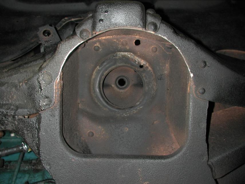 1. To allow the step in the lower Delrin ball half to slide into the factory shock hole, the bushing cup will need to be removed (if your car has one) and the hole may need to be drilled out to ¾. 2.