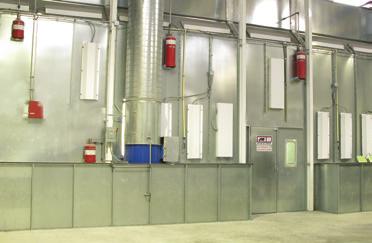 The filtered air is drawn down and away from the product through exhaust filters at the floor level along both sides.