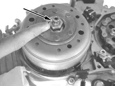 Apply Alumi-special paste on the top of the crankshaft (where goes to bearing on the cover) and install generator cover. Torque: 10 N m (1.0 kgf m) Start engine Attach the plug cap to the spark plug.