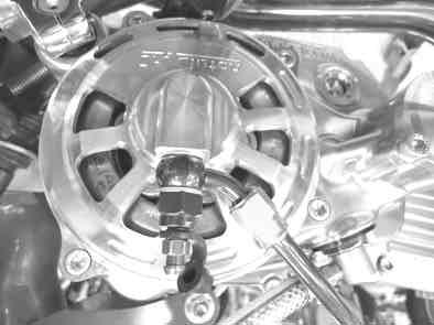 And by pulling and releasing the clutch lever some times, fill the clutch system with the brake fluid.