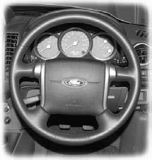 Steering wheel ADJUSTING THE STEERING WHEEL WARNING Never adjust the steering wheel when