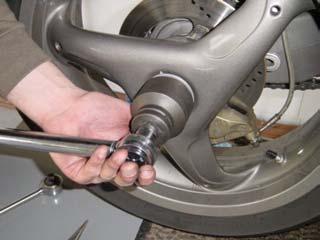 Place wheel onto spindle and align the pins with the holes located on the wheel.