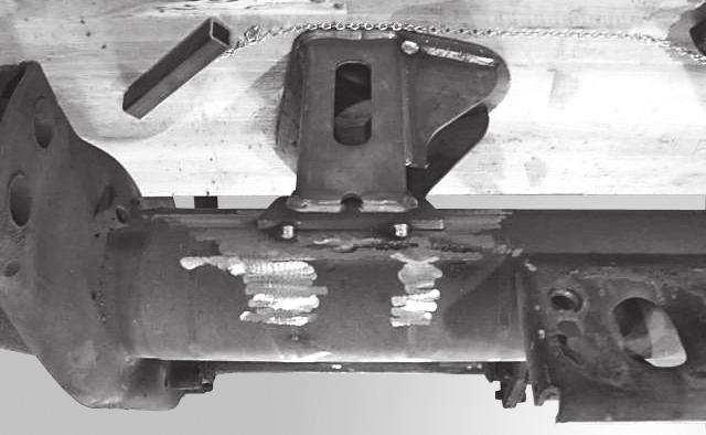 5. Place four tack welds on the seat-to-axle connection one inch (25 mm) from any edge. Figure 15. 7.