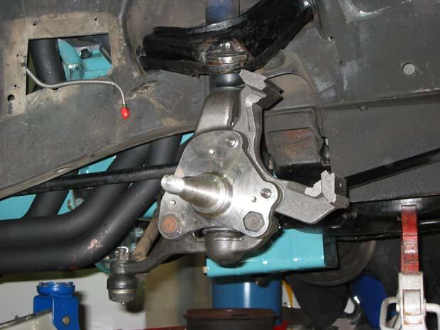 8. Install the new disc brake spindles Place the lower ball joint into the lower control arm and attach it with the original castle nut.