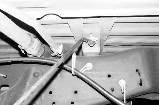 Repeat the procedure on the driver s side. Disconnect the parking brake cable bracket from the center pin (Fig 20). Take care not to over extend the brake lines. FIGURE 20 68.