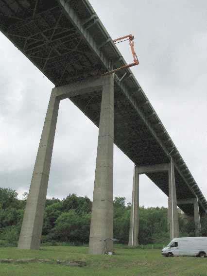 The locations were chosen to include the positive and negative moment regions, as well as the former pin and hanger joint location on each of the main girders in span four.
