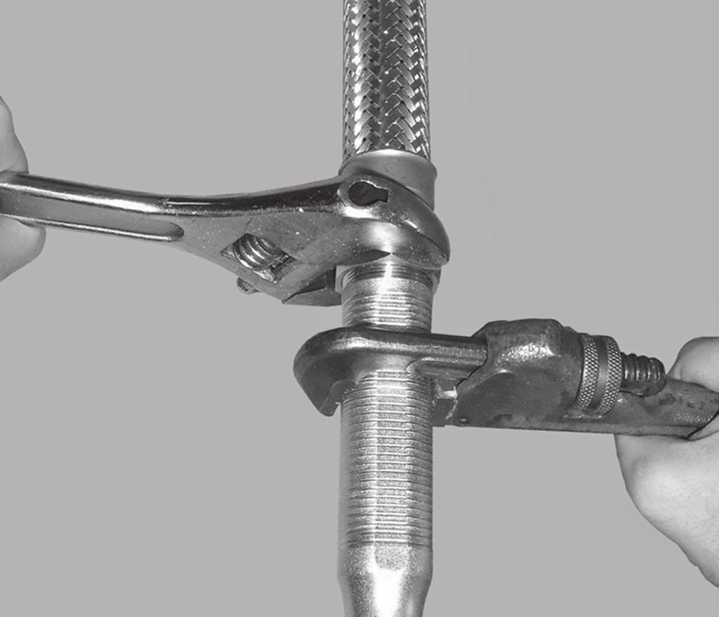 Using a pipe wrench, tighten the branch line connection nipple into the branch line.