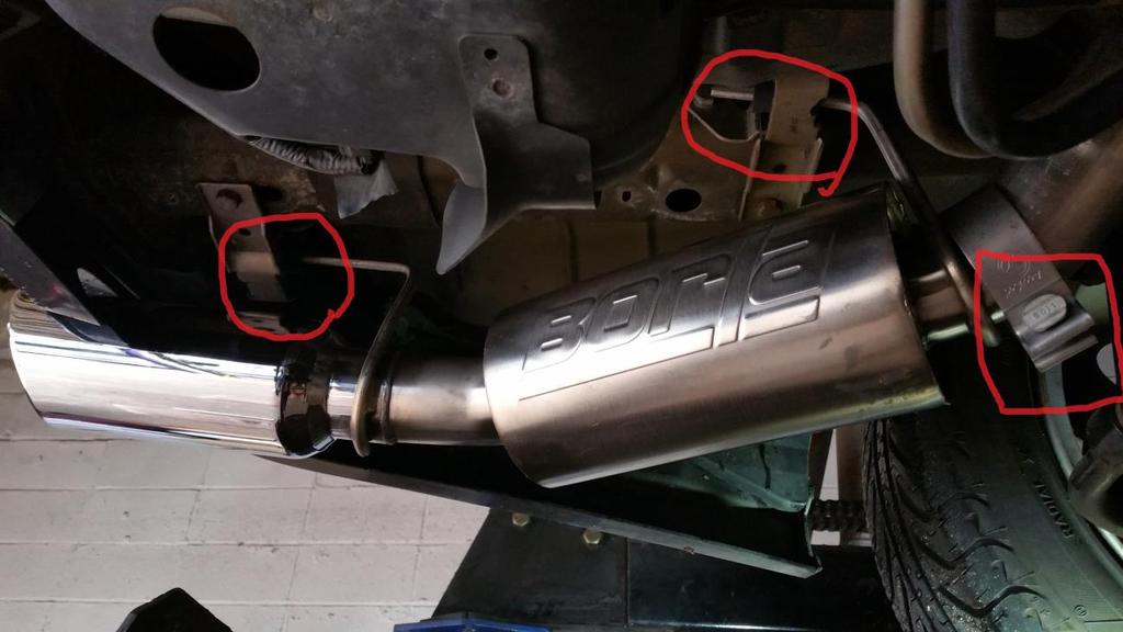 Left Muffler: 13. Place one of the OEM sleeve clamps over the straight portion of the new Borla piping and the OEM H-Pipe. Tighten the clamp just enough to hold it on. See picture in step 8, above.