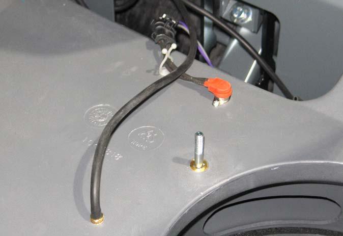 Disconnect the main wire harness from the filter shaker assembly and remove the