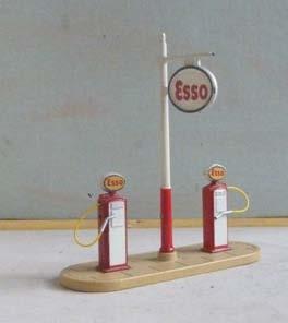 Plinth with two 'Esso' pumps and 'Esso' sign on central pole.