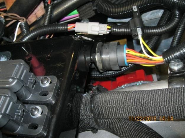 Page 11 of 14 Plug the chassis harness into the