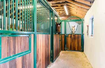 stables, tack room, feed room and ample storage. Charles Britton Manège/school approx.