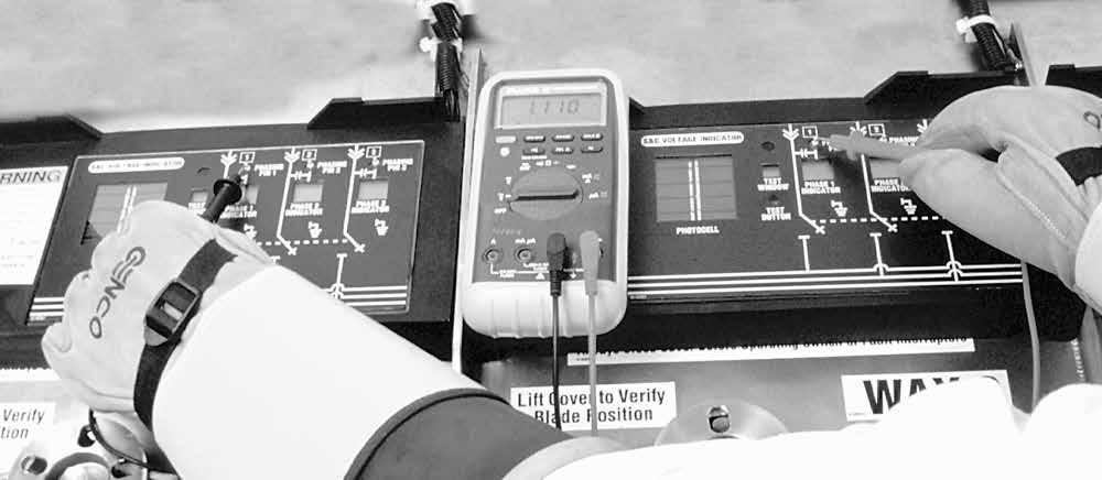 STEP 4. Determine the phase-to-phase relationships of the two ways to be phased as follows: (a) Remove the test probe of the voltmeter from the switchgear tank.