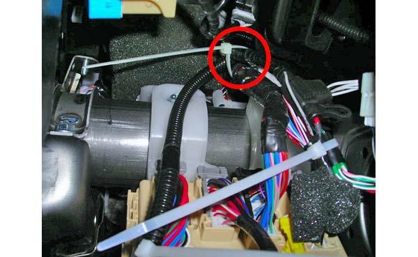 (d) Secure the interior light harness to the OE harness with one (1) cable tie above the metal bar (Fig. 4-3).