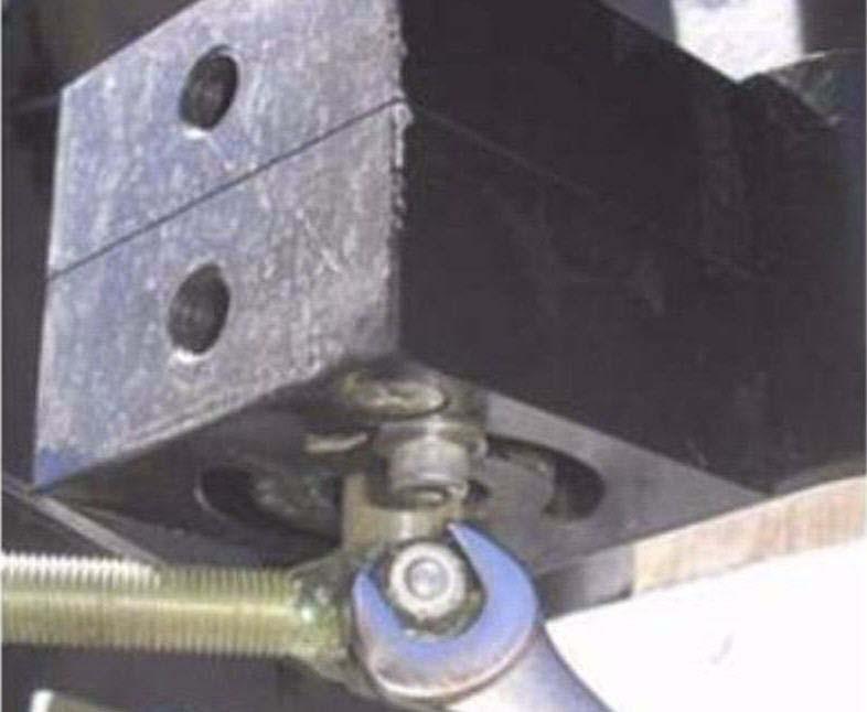Attaching and Adjusting Wheel Angle Sensor Linkage Rods 4. Tighten the connection with a 3/8" wrench and 1/8" Allen wrench. See Figure 2-34. Note: The rod should point towards the vehicle rear.